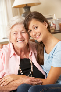 Teenage Granddaughter Visiting Grandmother At Home